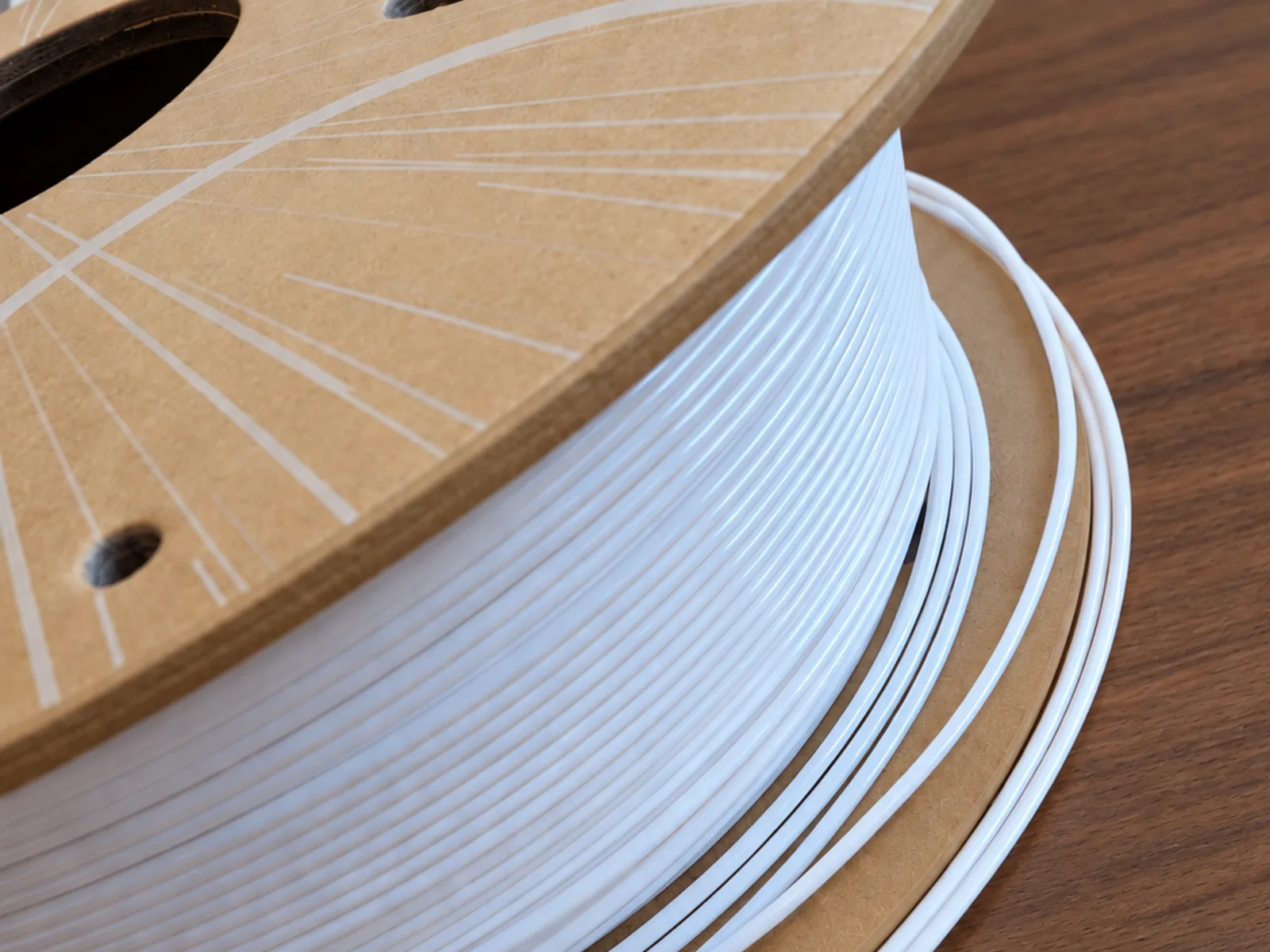 A spool of translucent PETG filament used to print the lamps