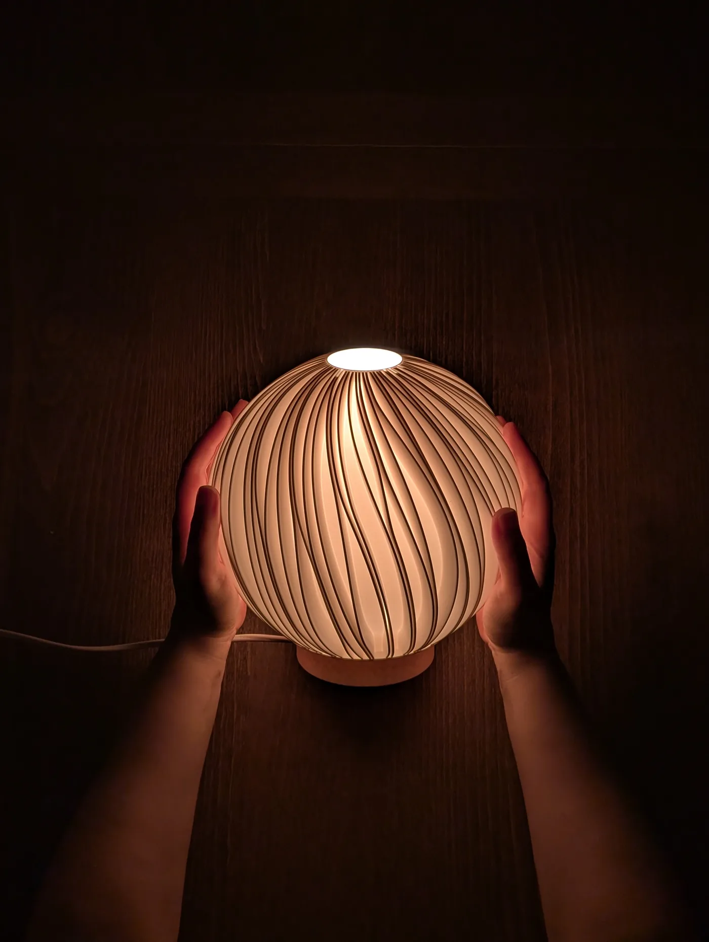Rima Mellem lamp held in one hand for scale